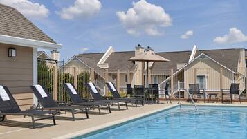 Outdoor pool, open 10:00 AM to 10:00 PM, pool umbrellas