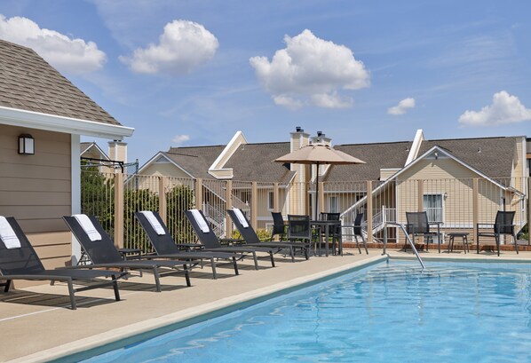 Outdoor pool, open 10:00 AM to 10:00 PM, pool umbrellas