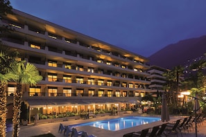 Outdoor pool, open 7:00 AM to 10:00 PM, pool umbrellas, sun loungers