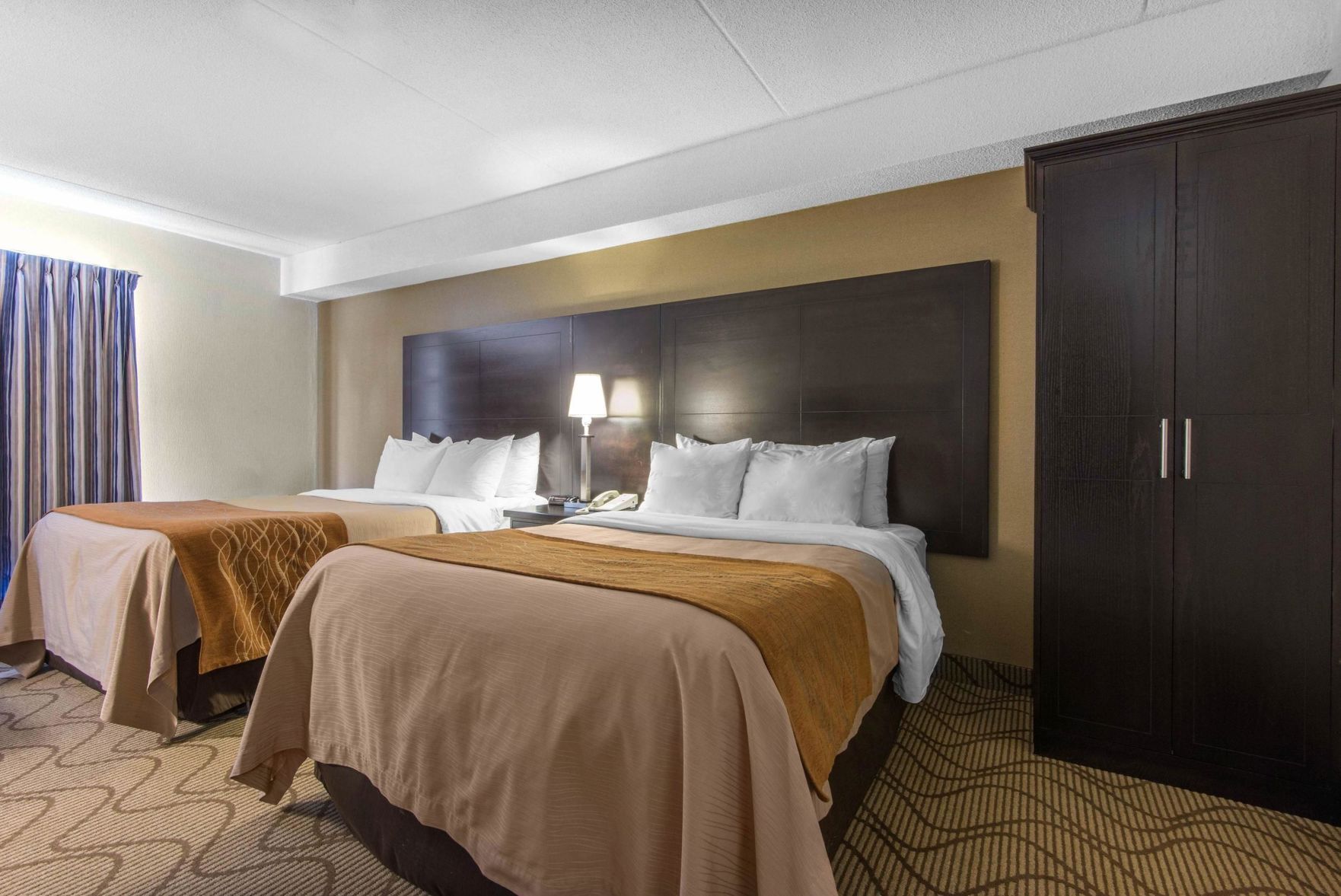 Premium bedding, pillow-top beds, desk, blackout curtains