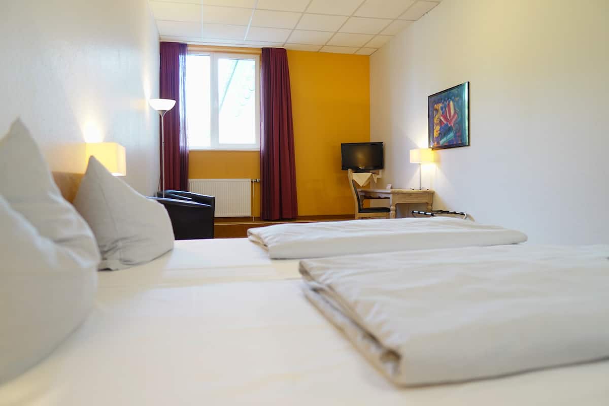 Essential Room with Double Bed | In-room safe, desk, blackout drapes, iron/ironing board