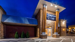 A building with a sign reading "Crazy Cow Cafe" and a brick facade. - Best Western Paradise Inn (Beaver)