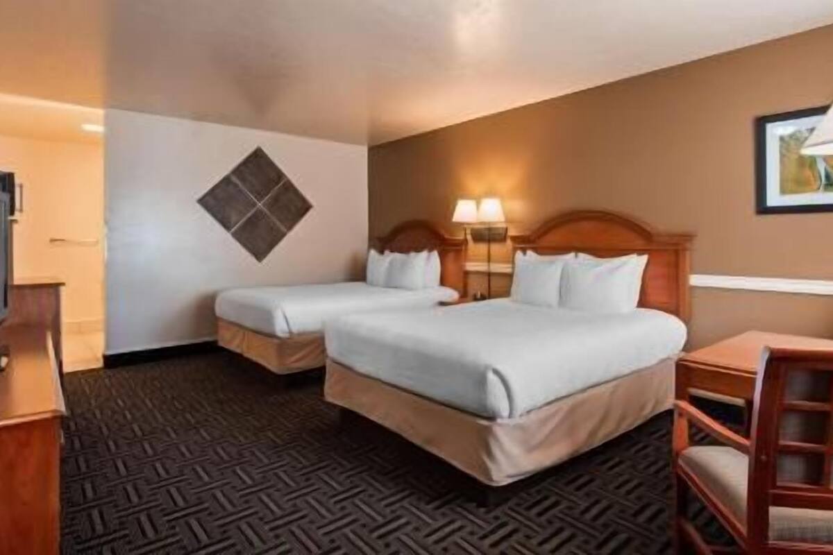 Laptop workspace, iron/ironing board, free cribs/infant beds