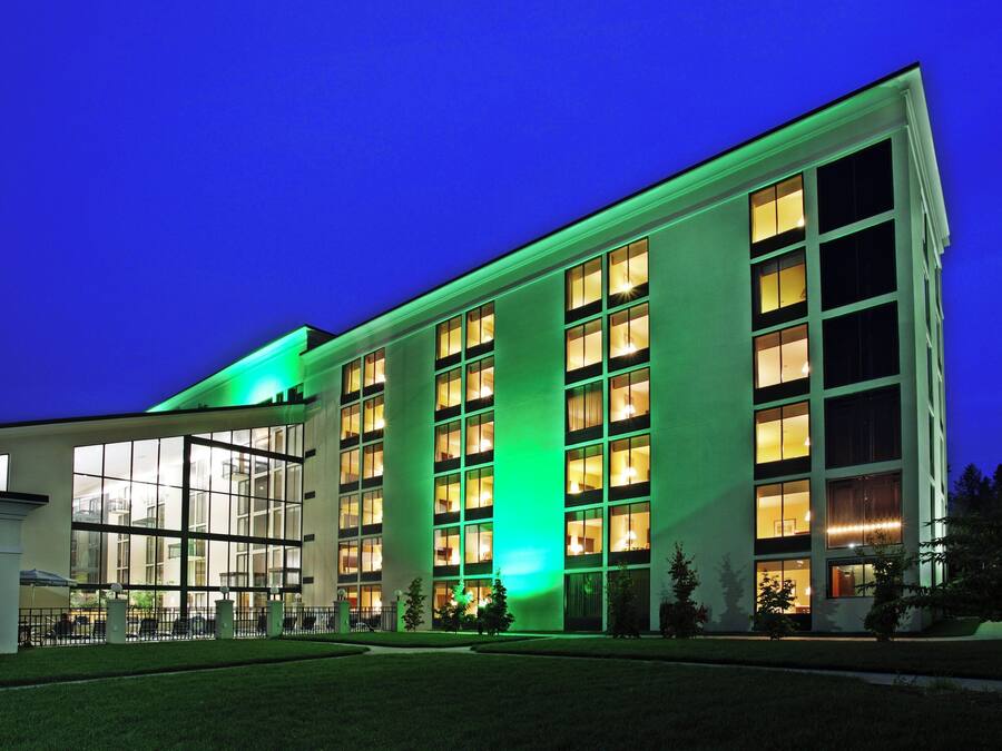 A modern building with a glass facade and multiple windows.