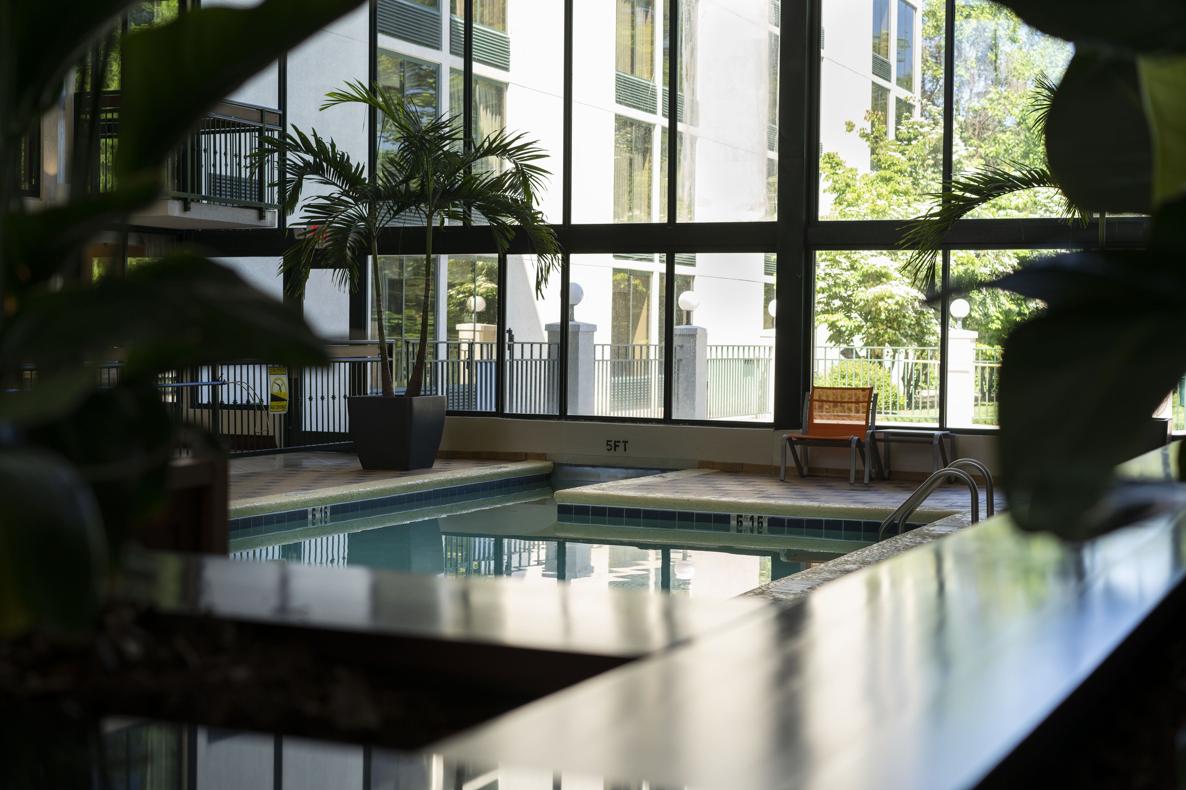 indoor pool, seasonal outdoor pool, pool umbrellas, pool loungers