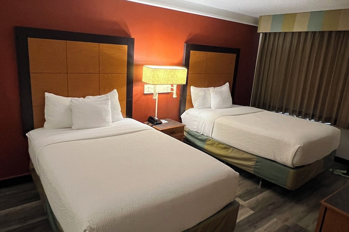Premium bedding, desk, laptop workspace, blackout curtains