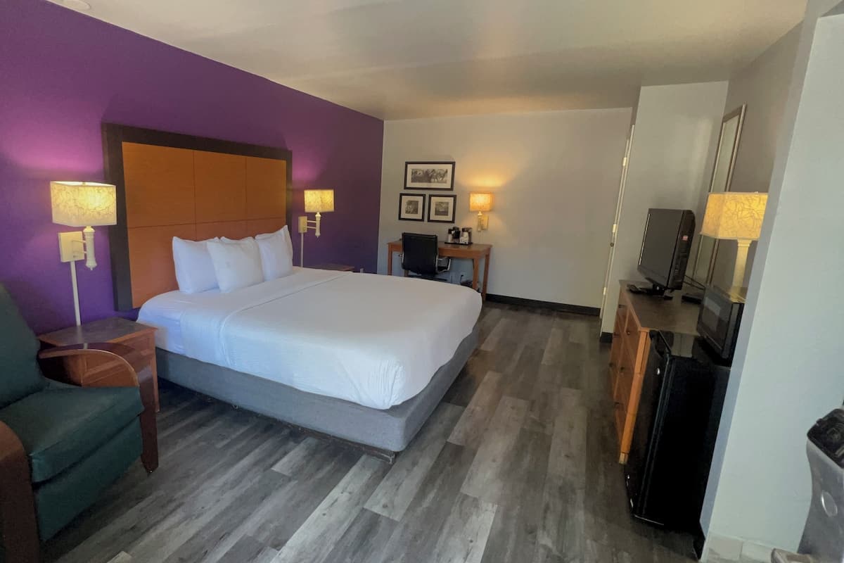 Premium bedding, desk, laptop workspace, blackout curtains