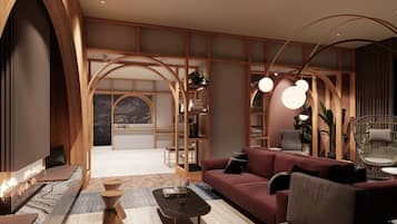 Una sala de estar moderna con sofá, mesa de centro y chimenea.