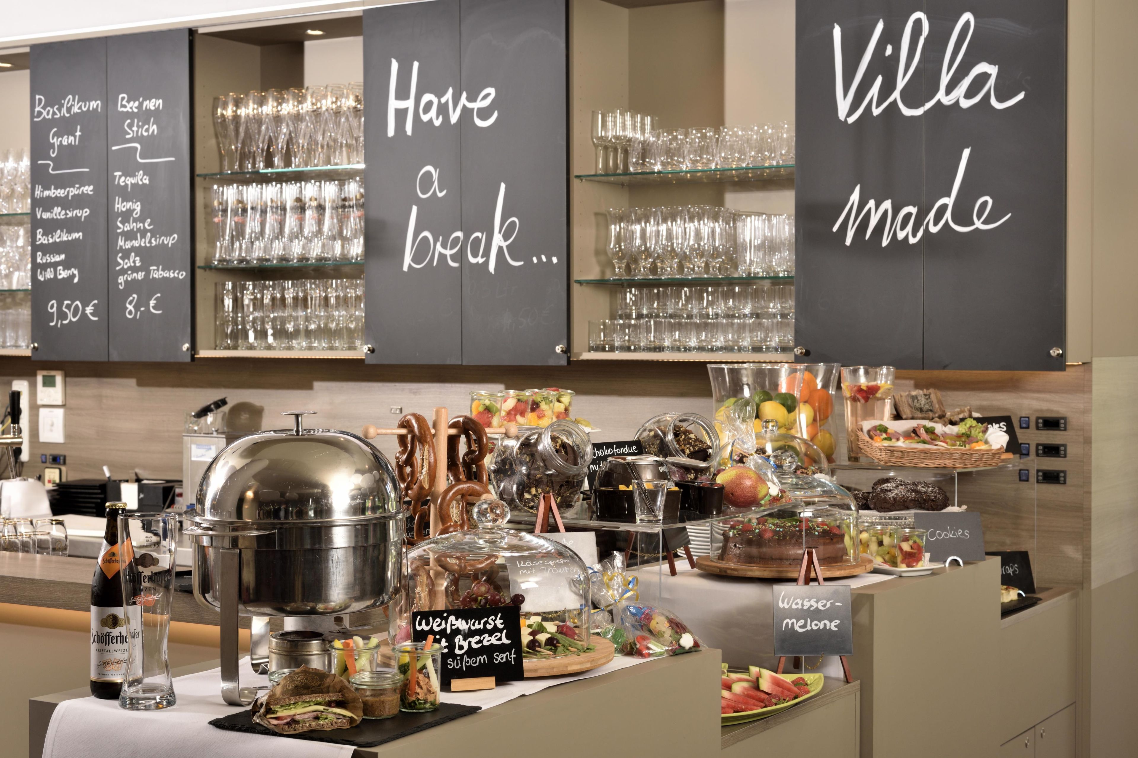 A breakfast buffet with a variety of food options and a selection of drinks.