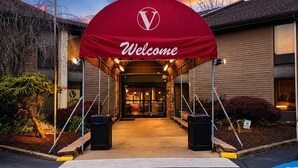 A hotel entrance with a red archway and a 'Welcome' sign. - The View Inn & Suites (Bethlehem)
