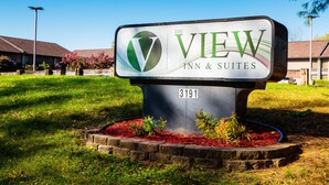 A sign for The View Inn & Suites, featuring a logo and the name prominently displayed. - The View Inn & Suites (Bethlehem)
