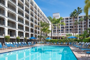 Outdoor pool, pool umbrellas, sun loungers