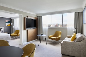 Executive Suite, 1 Bedroom | Living area | 49-inch flat-screen TV with satellite channels, TV