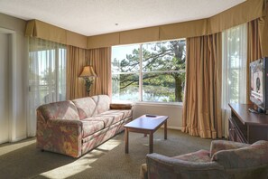 Deluxe Condo, 2 Bedrooms | Living area | 27-inch flat-screen TV with cable channels, TV, pay movies