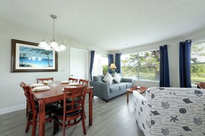 Premium Suite, 2 Bedrooms | Living area | 32-inch flat-screen TV with cable channels, TV