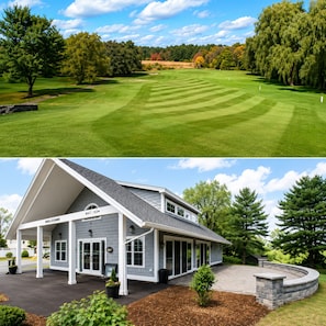 A golf course with a well-maintained green and a house with a 'WELCOME' sign, a covered porch, and a stone retaining wall.