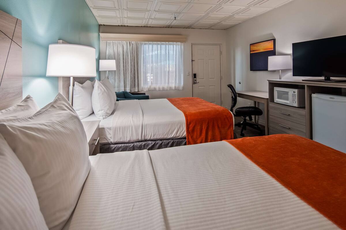 standard room, 2 queen beds, non smoking, refrigerator & microwave | desk, blackout curtains, iron/ironing board, free cots/infant beds