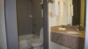 Combined shower/bathtub, towels, soap, shampoo