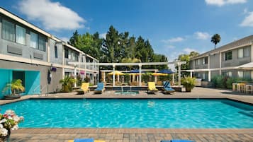 Outdoor pool, open 9:00 AM to 10:00 PM, pool umbrellas, pool loungers
