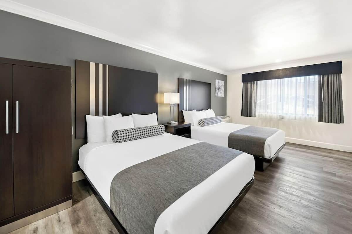 Pillow-top beds, desk, laptop workspace, blackout curtains