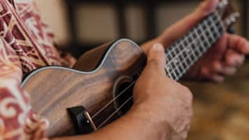 A person playing a ukulele.