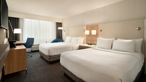 A hotel room with two beds, a desk, a chair, and a TV. - Crowne Plaza: Philadelphia - King of Prussia by IHG (King of Prussia)