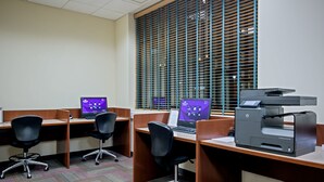 A modern office space with cubicles, individual desks, and a large printer. - Crowne Plaza: Philadelphia - King of Prussia by IHG (King of Prussia)