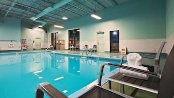 Indoor pool, open 9:00 AM to 9:00 PM, pool loungers