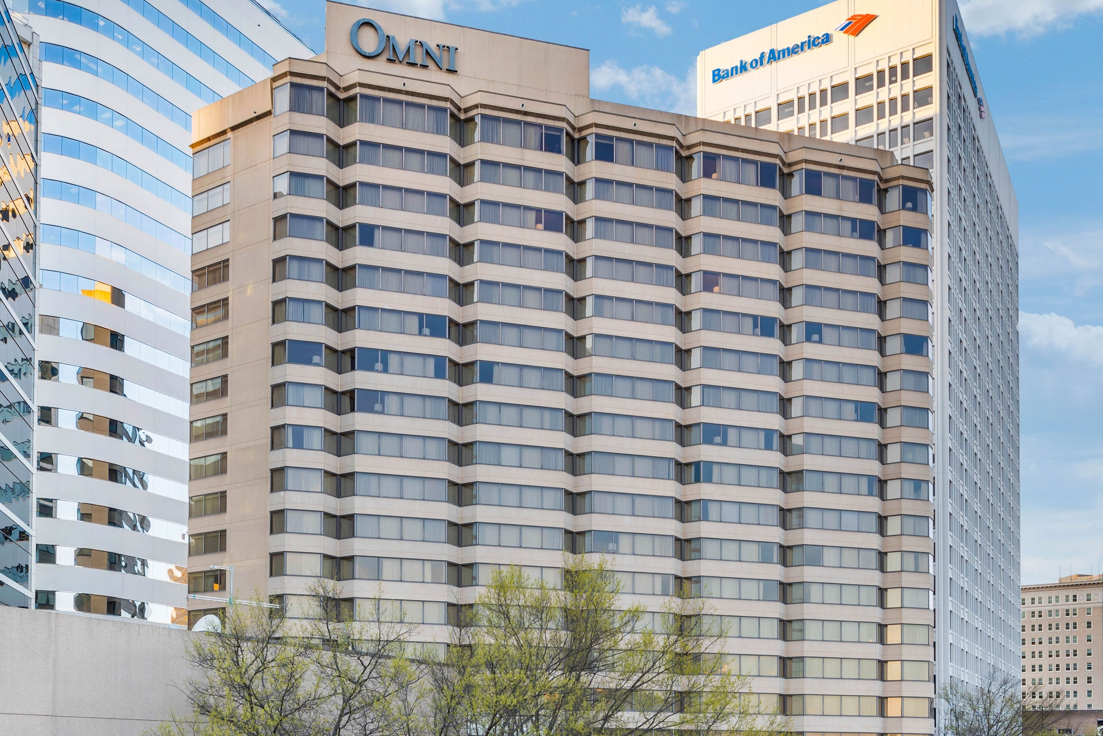 A multi-story building with a prominent OMNI sign and Bank of America logo.