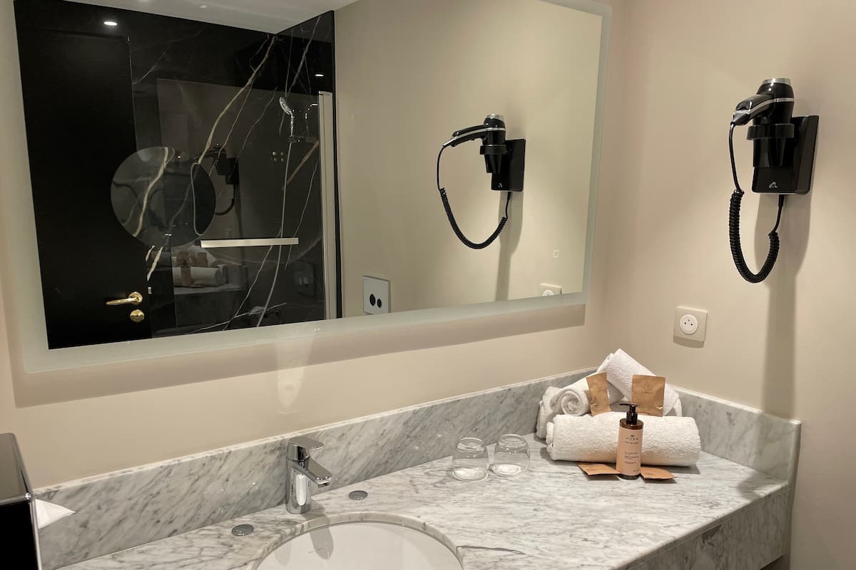 Eco-friendly toiletries, hair dryer, towels