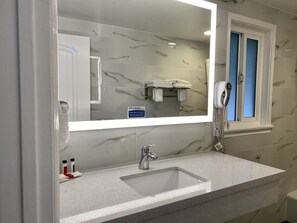 Combined shower/bathtub, hair dryer, towels, soap