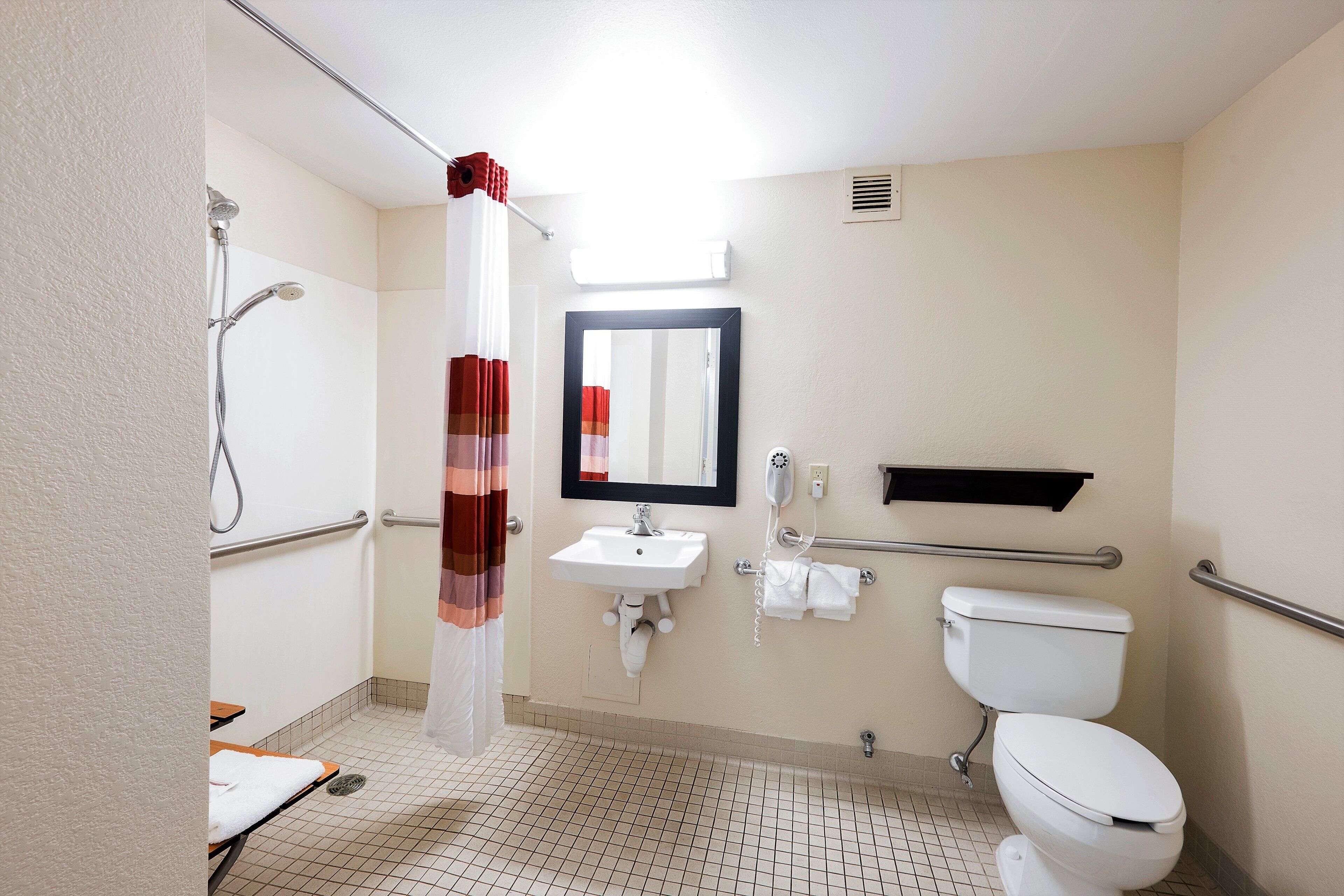 Superior Room, 1 King Bed, Accessible (Roll-In Shower, Smoke Free) | Bathroom | Combined shower/tub, free toiletries, towels