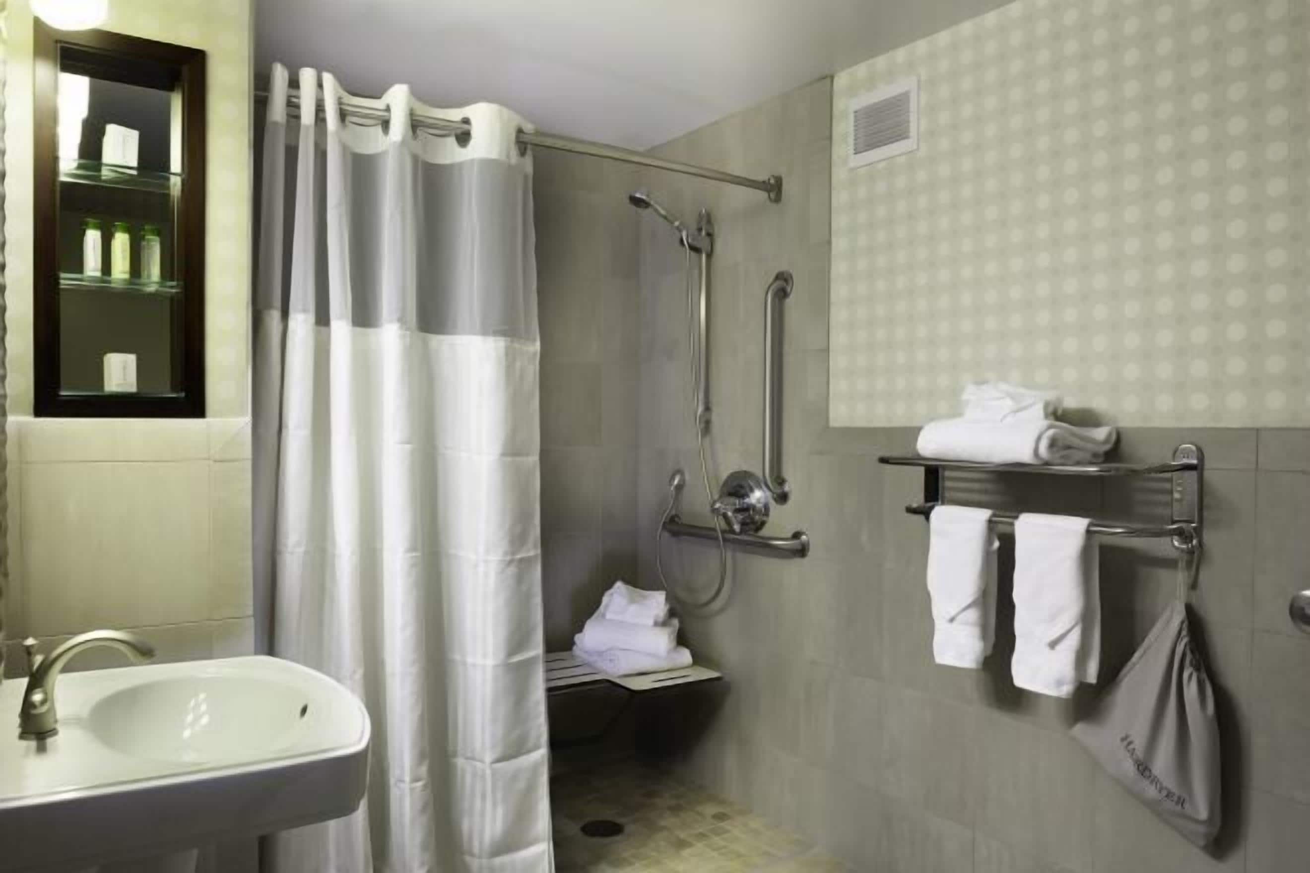 Bathroom | Designer toiletries, hair dryer, towels, soap