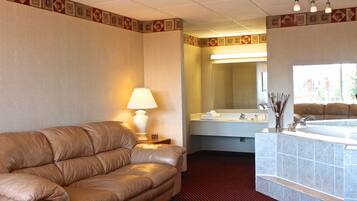Deluxe Room, 1 King Bed, Refrigerator & Microwave | Living area | TV