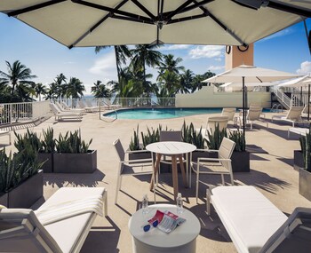 In-room safe, blackout drapes, iron/ironing board, cribs/infant beds at Park Shore Waikiki