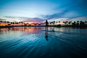 On the beach, white sand, sun loungers, beach umbrellas