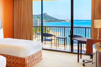 Hotel amenities such as safe, desk and work area at Hilton Hawaiian Village Waikiki Beach Resort