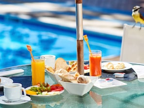 Outdoor pool, open 9:00 AM to 10:00 PM, pool umbrellas, sun loungers