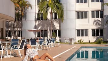 Outdoor pool, open 9:00 AM to 10:00 PM, pool umbrellas, sun loungers