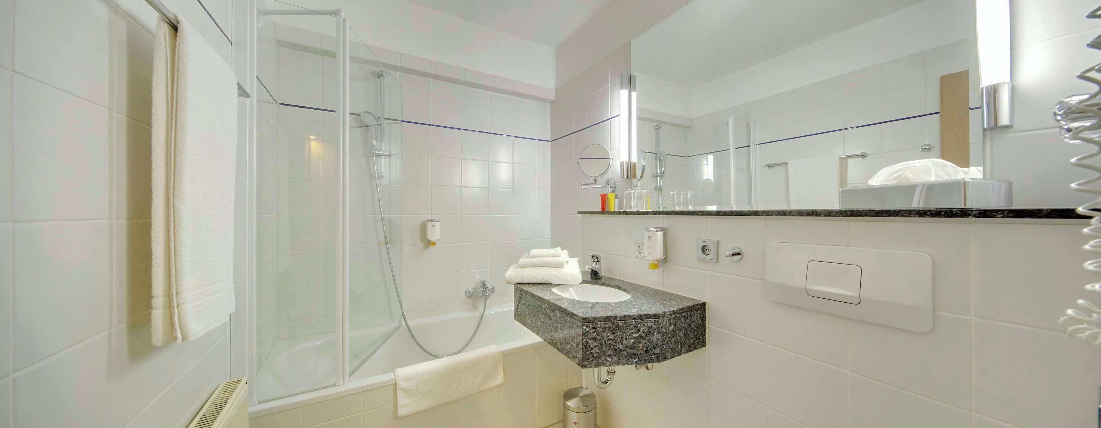 combined shower/bathtub, rainfall showerhead, designer toiletries