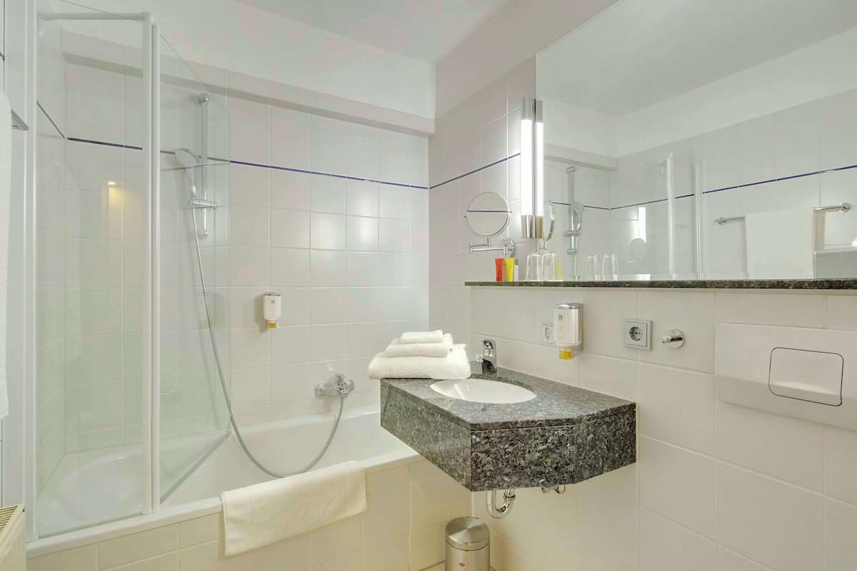 combined shower/bathtub, rainfall showerhead, designer toiletries