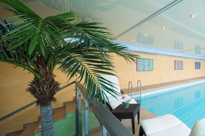 Indoor pool, open 7:00 AM to 10:00 PM, sun loungers