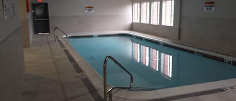 Indoor pool, open 8:00 AM to 11:00 PM, pool loungers