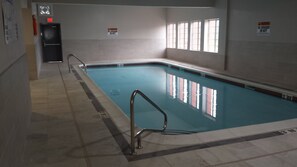 Indoor pool, open 8:00 AM to 11:00 PM, pool loungers