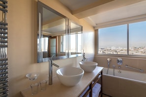 Shower, designer toiletries, hair dryer, towels