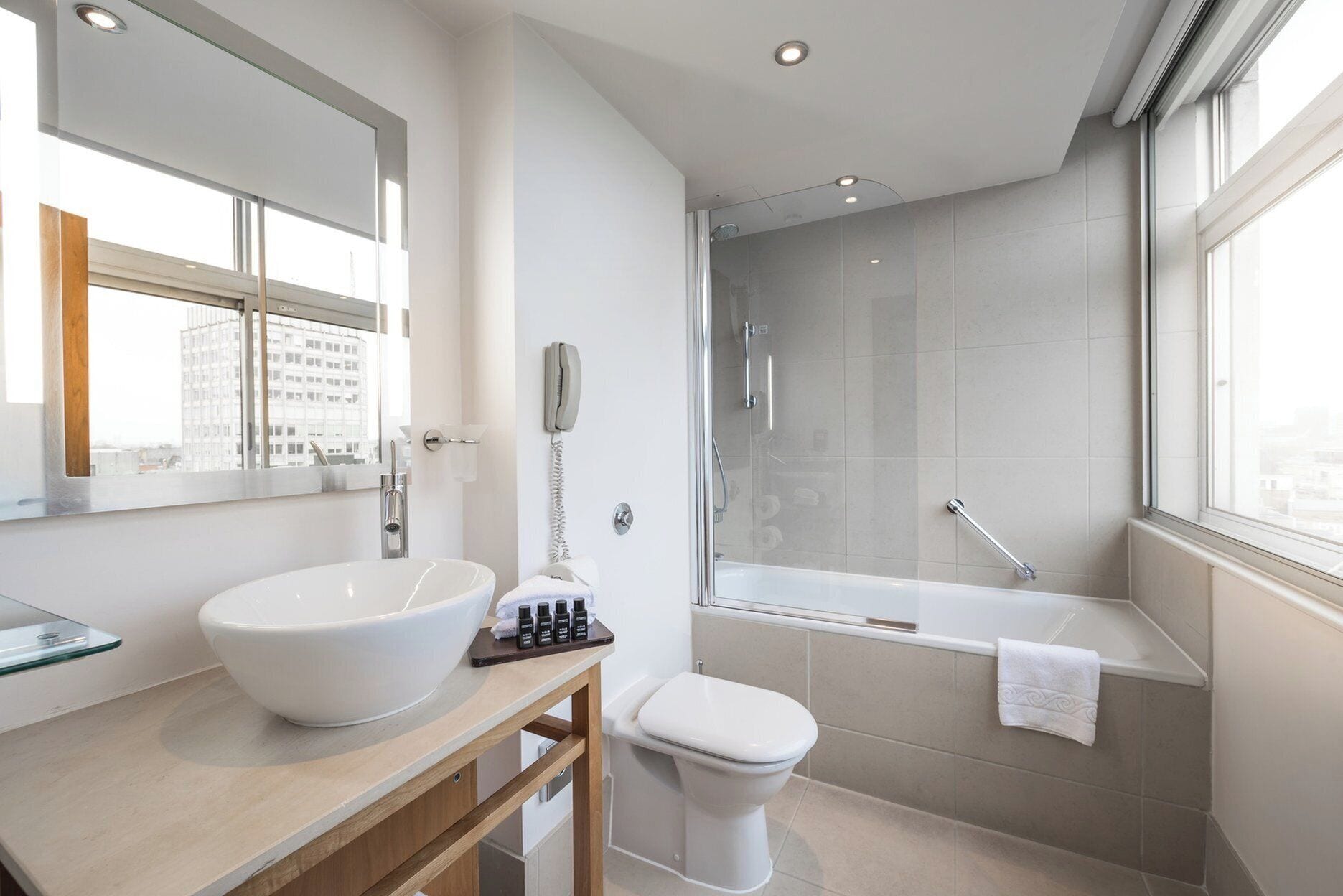 shower, designer toiletries, hair dryer, towels