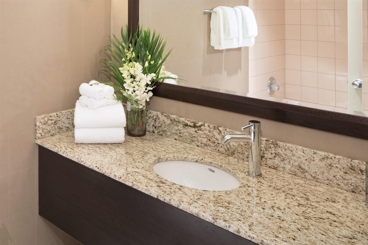 room, 2 queen beds | bathroom | combined shower/bathtub, eco-friendly toiletries, hair dryer, towels