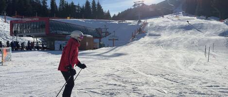 A ski slope with a ski lift and a building labeled "Fitzsimmons Express".
