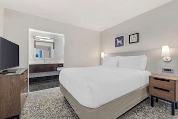 A gym with treadmills, elliptical machines, and a stationary bike. at Sonesta ES Suites Torrance Redondo Beach