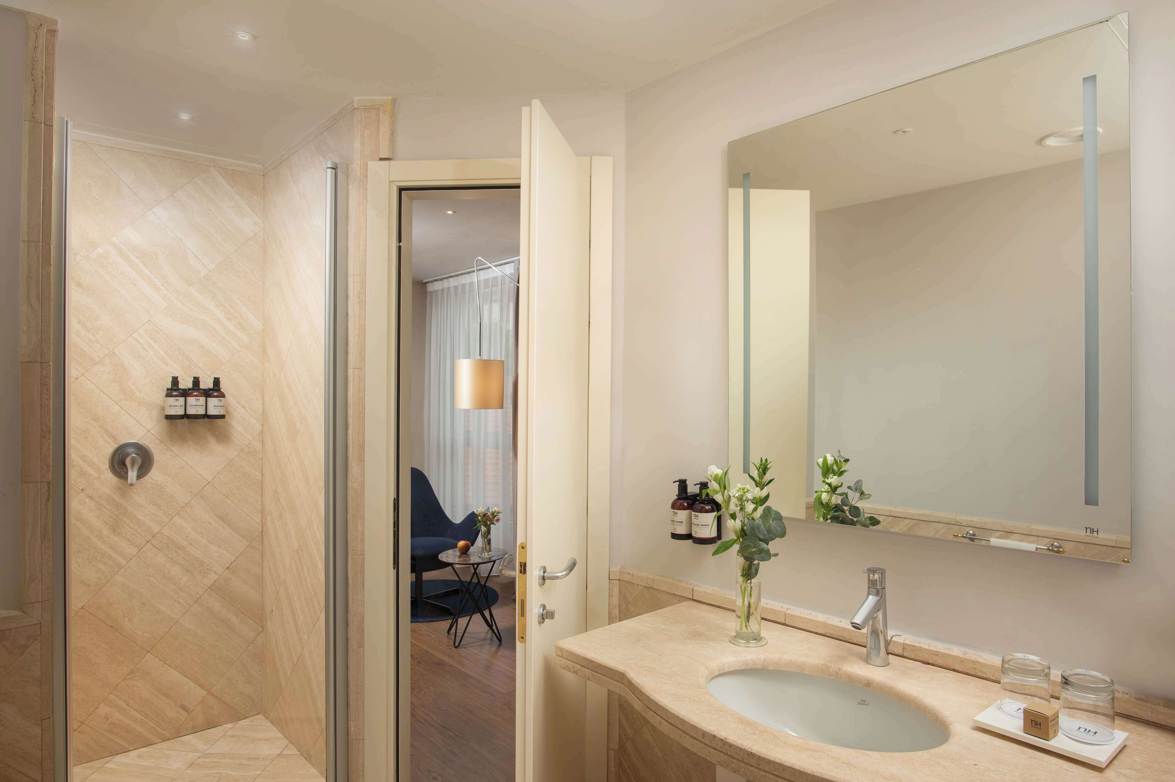 deep-soaking bathtub, rainfall showerhead, eco-friendly toiletries